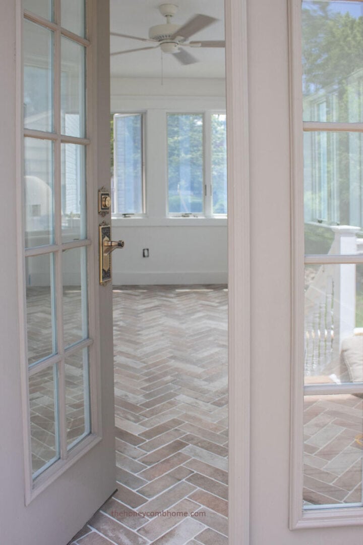 sunroom-french-doors-and-brick-herringbone-floors-the-honeycomb-home